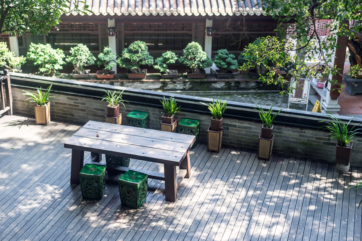chairs and a table in a small wood platform